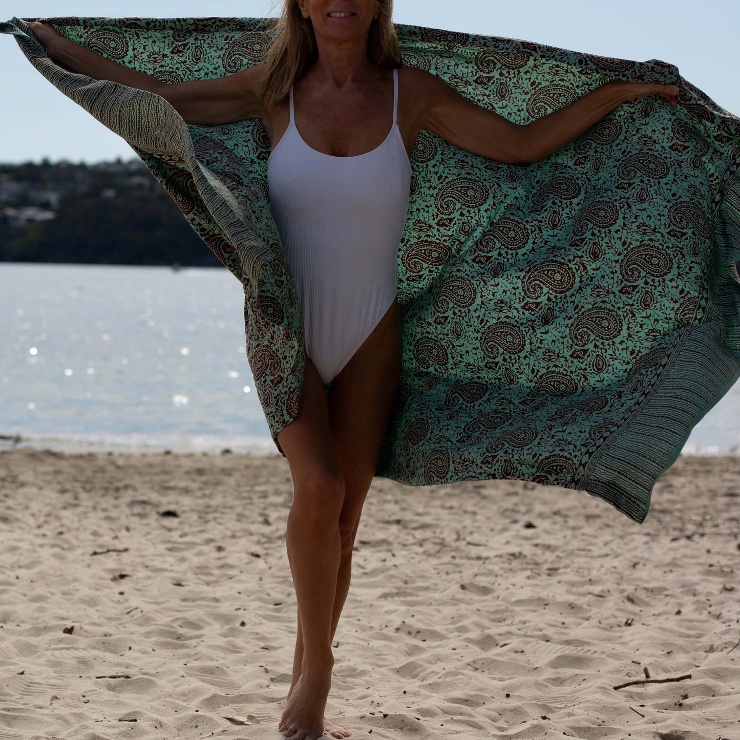 Close-up of green earth luxe sarong pattern, ideal for warm weather