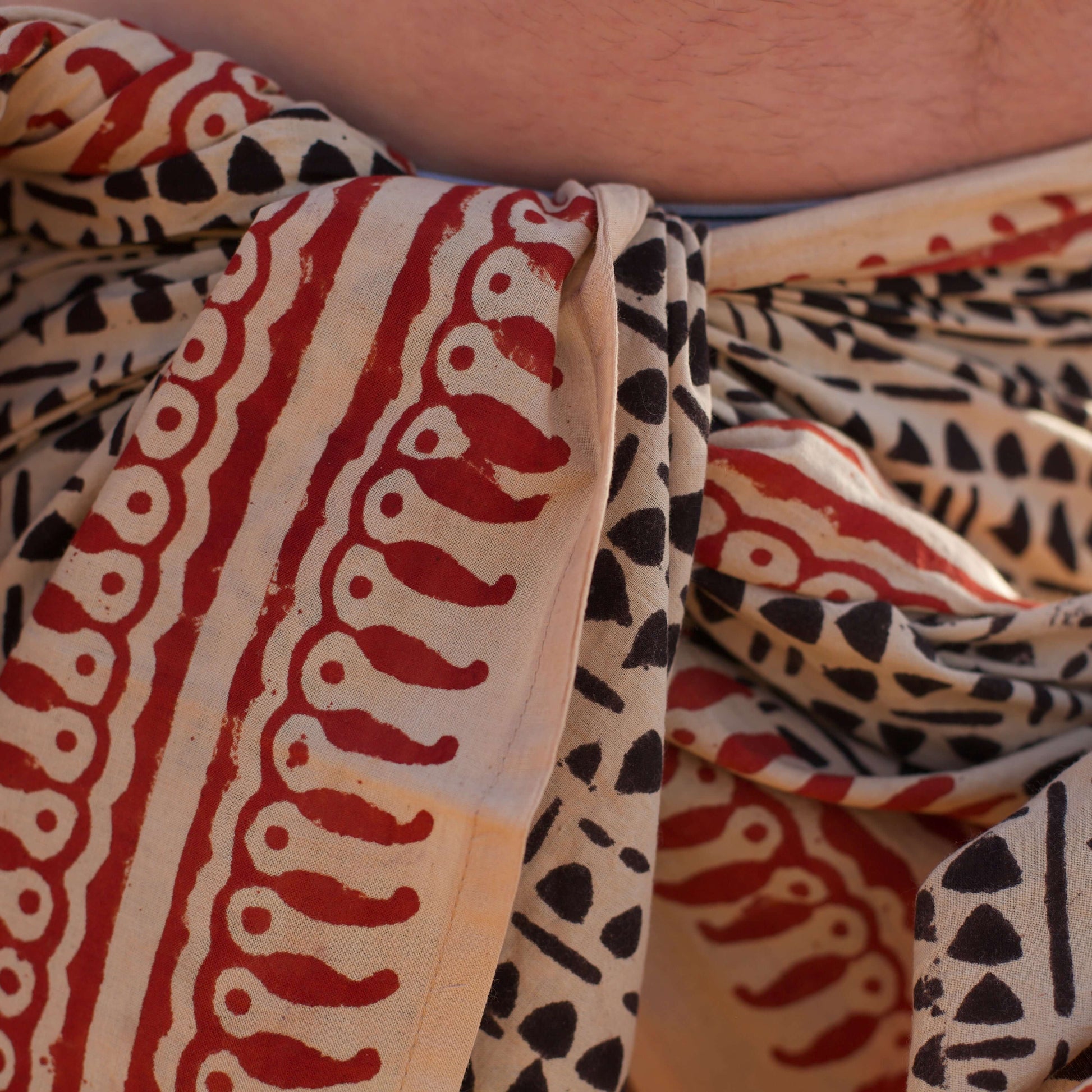 Close-up of Batik Cotton Mens Sarong hip detail — finely stitched edges, 100% cotton, easy-care.