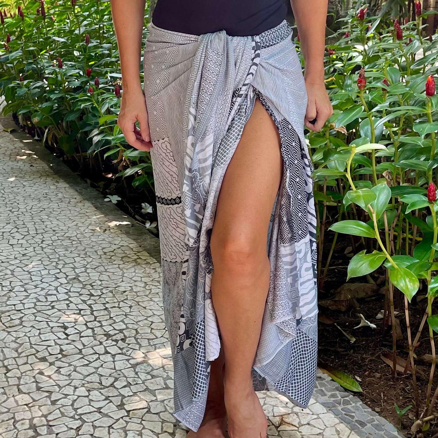 Batik monochrome sarong beachwear look, photographed outdoors in natural light