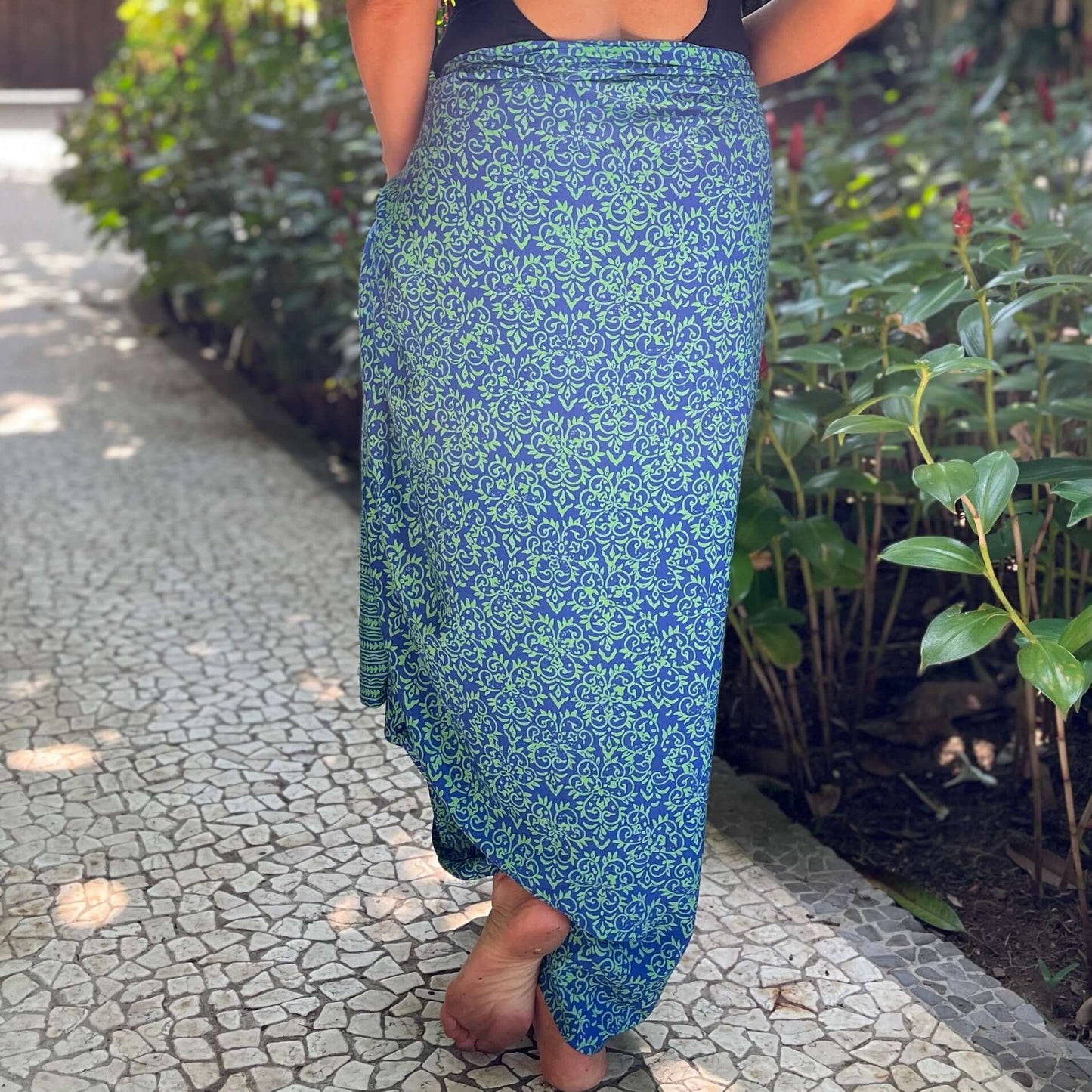 Civilisation luxe sarong styled on beach model wearing sarong hut design
