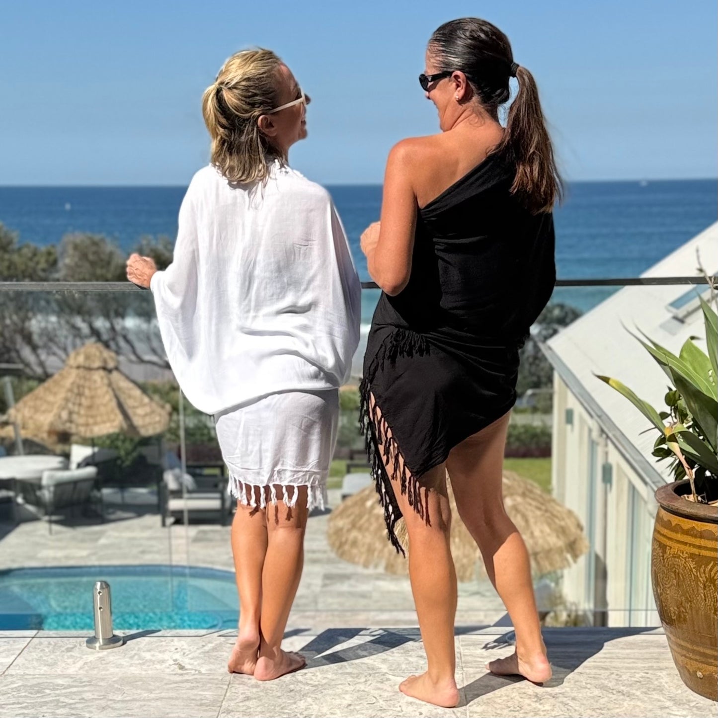 Classic white beach sarong worn as beach cover-up, flowing rayon fabric