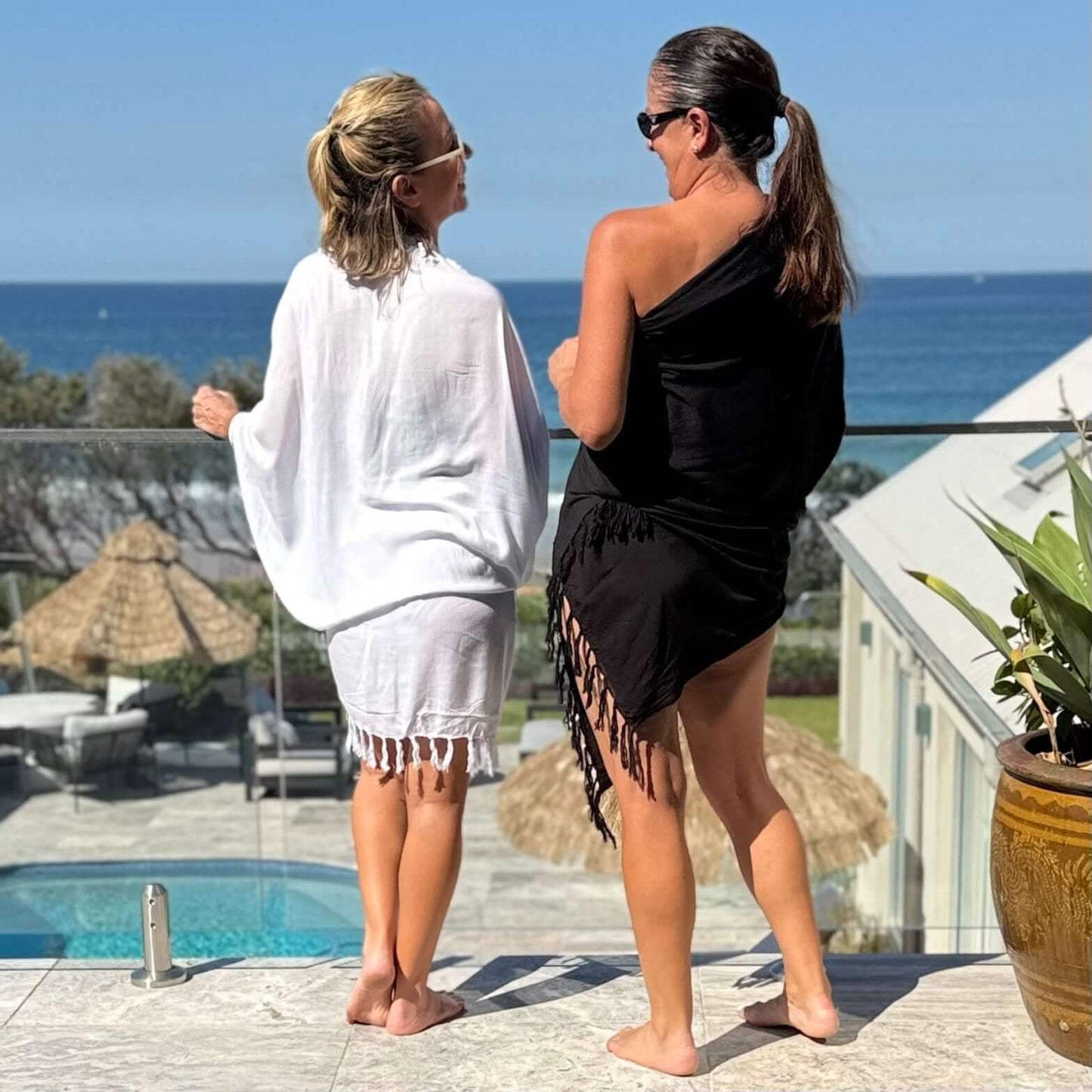 Classic white beach sarong worn as beach cover-up, flowing rayon fabric