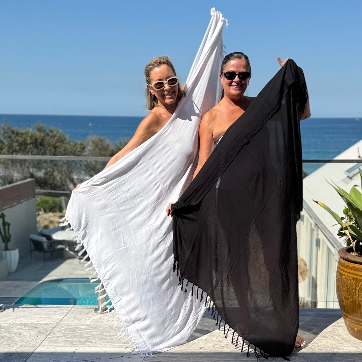 Close-up of classic white beach sarong pattern, ideal for warm weather