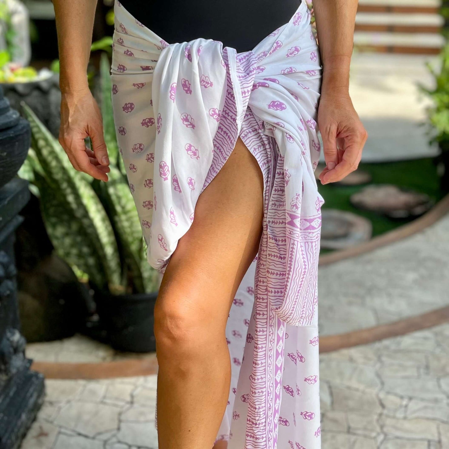 Firefly pink luxe beachwear look, photographed outdoors in natural light