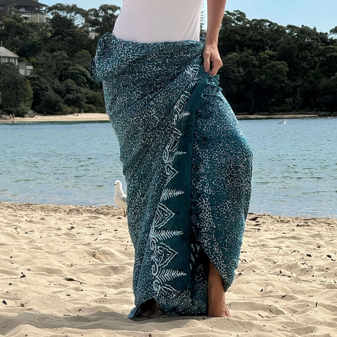 Free spirit teal beach sarong worn as beach cover-up, flowing rayon fabric