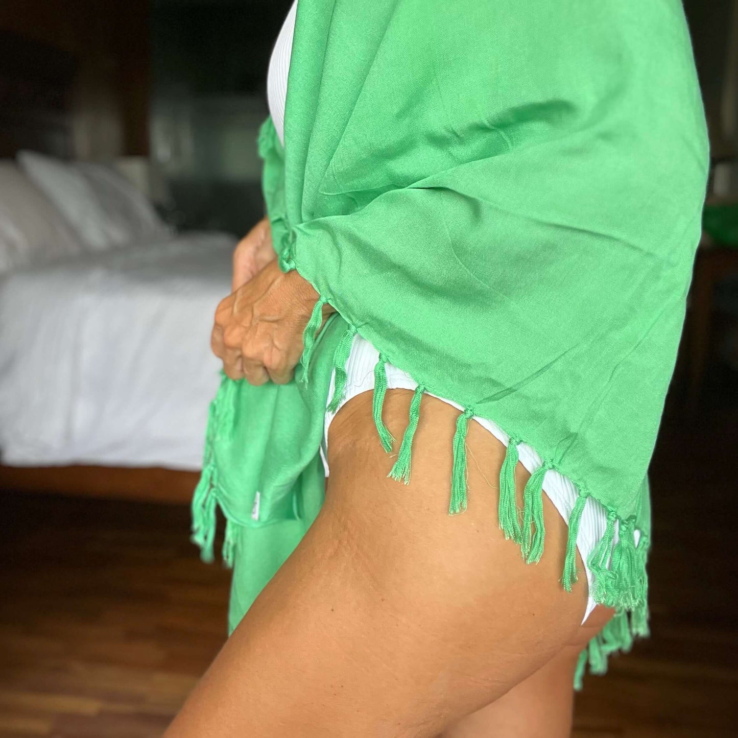 Green pop beach sarong worn as beach cover-up, flowing rayon fabric