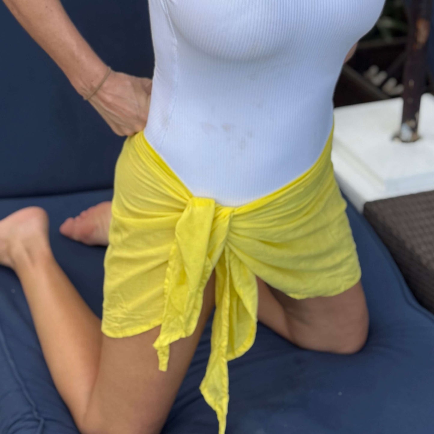 Mini sarong lemon worn as beach cover-up, flowing rayon fabric