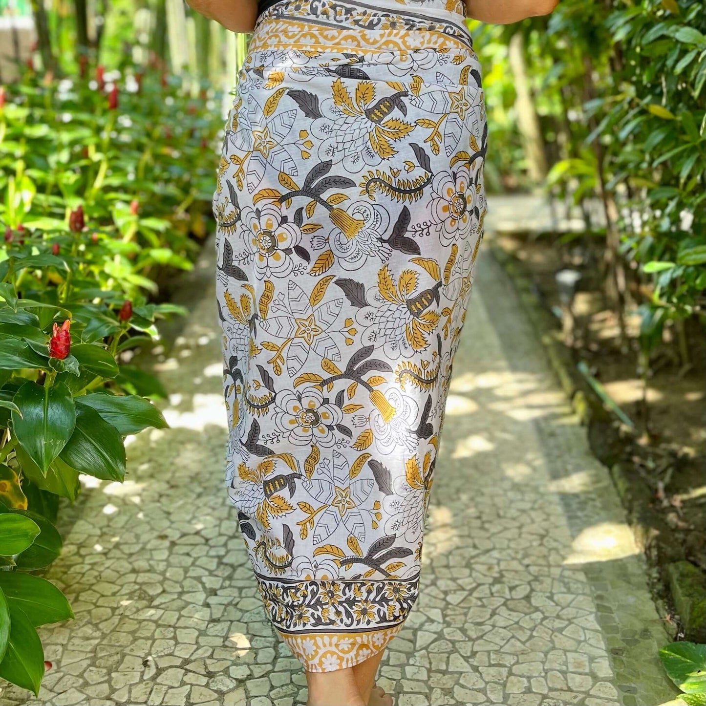 Palm desert cotton sarong beachwear look, photographed outdoors in natural light
