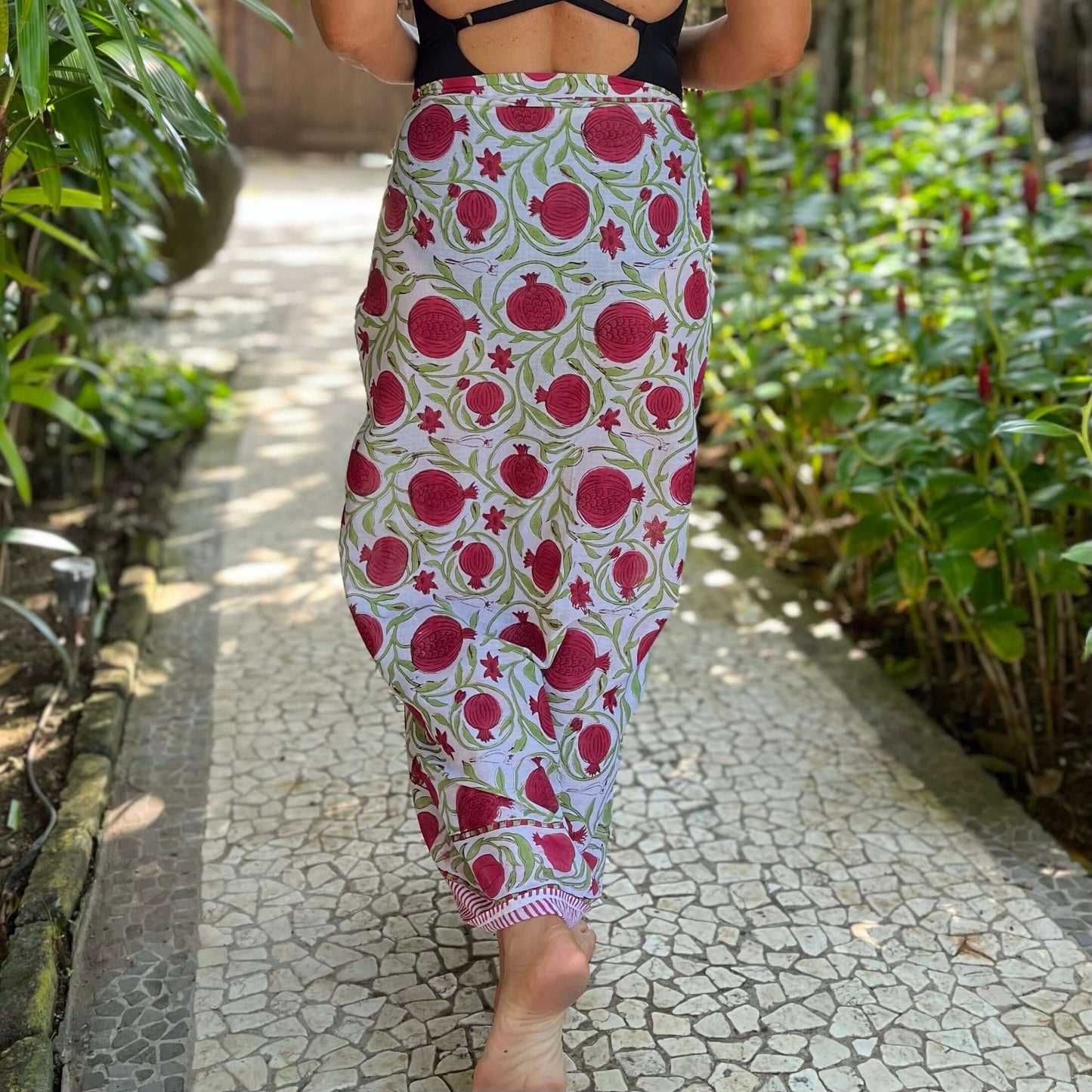 Close-up of pomegranate cotton sarong pattern, ideal for warm weather