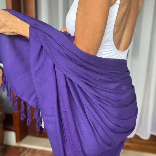 Purple pop beach sarong beachwear look, photographed outdoors in natural light