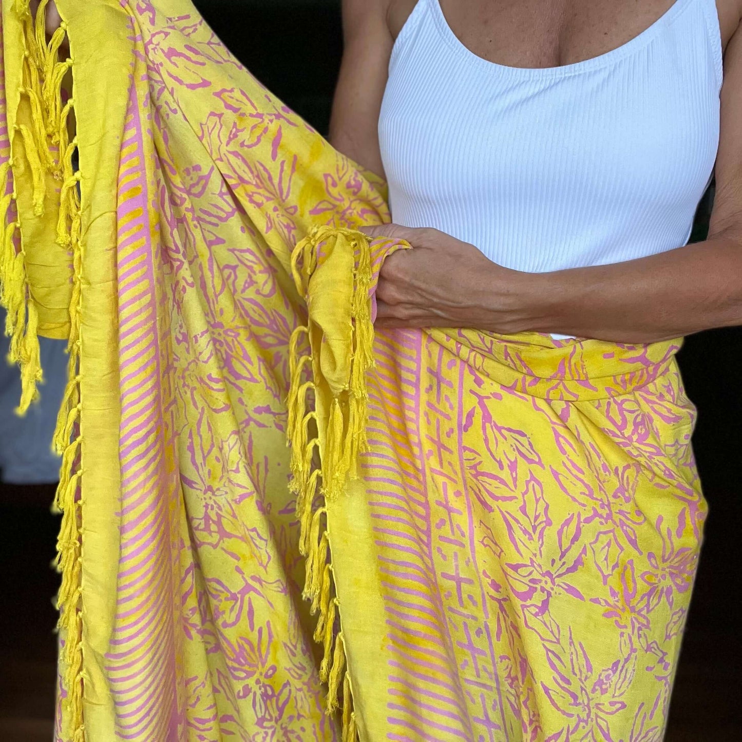 Relaxed beach sarong beachwear look, photographed outdoors in natural light