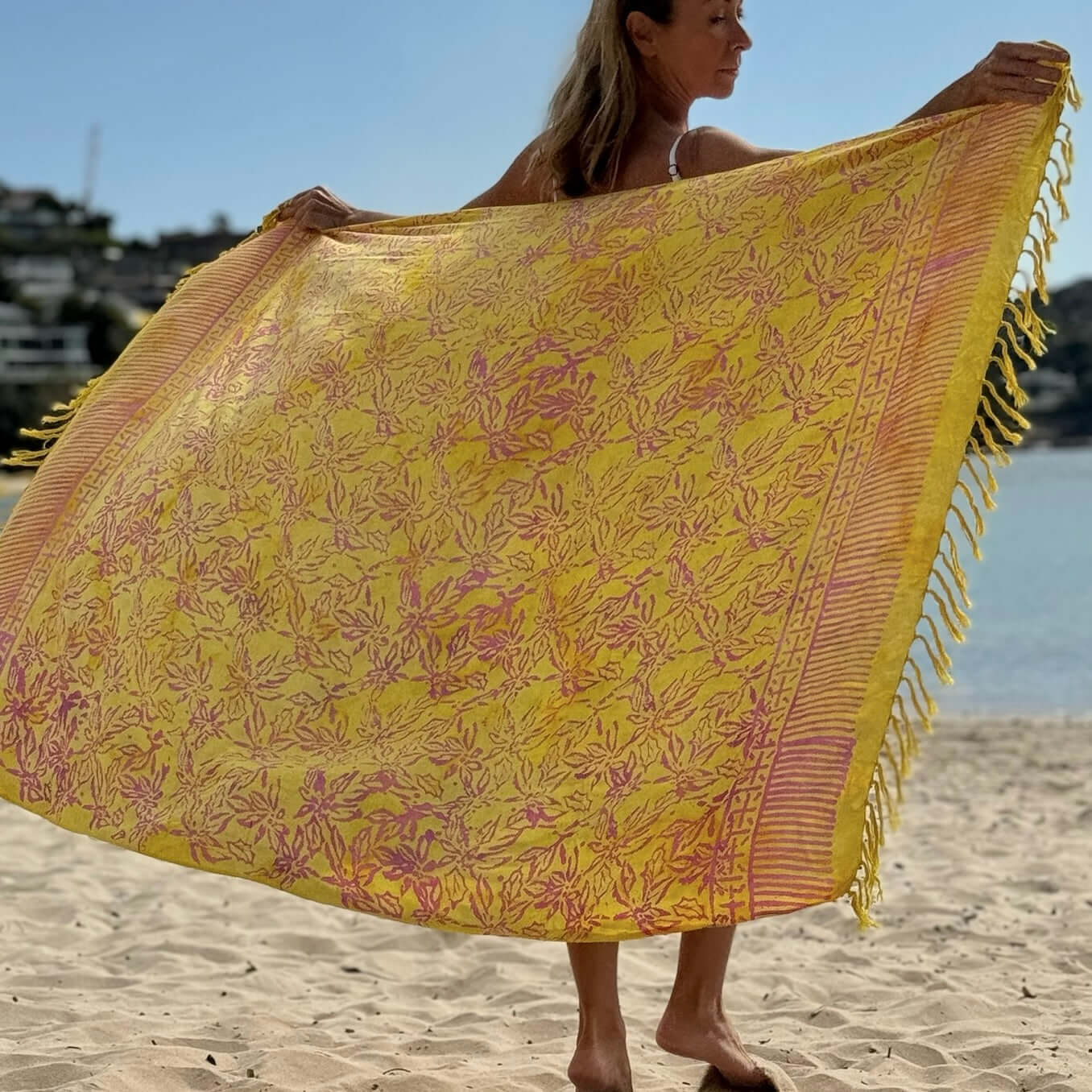 Relaxed beach sarong worn as beach cover-up, flowing rayon fabric