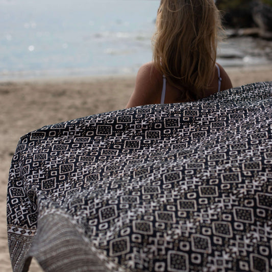 Release luxe sarong beachwear look, photographed outdoors in natural light