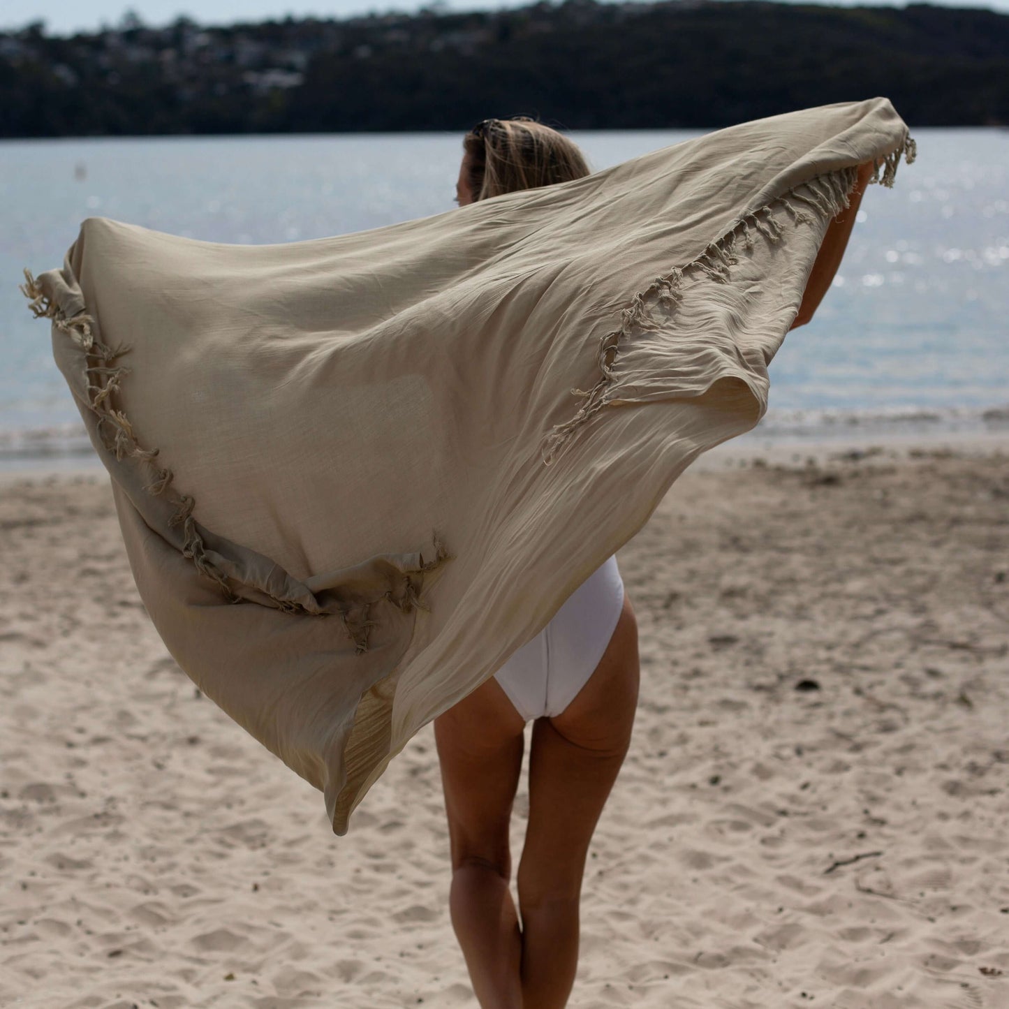 Sand beach sarong beachwear look, photographed outdoors in natural light