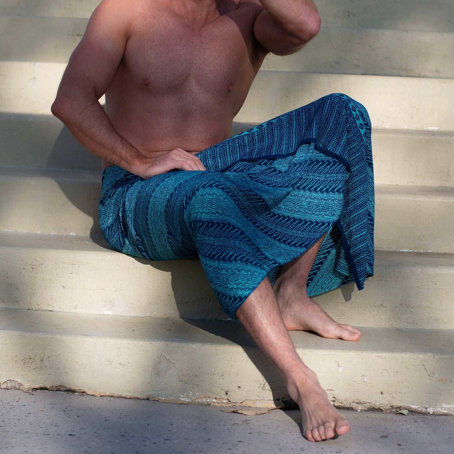 Close-up of vivid luxe mens sarong pattern, ideal for warm weather