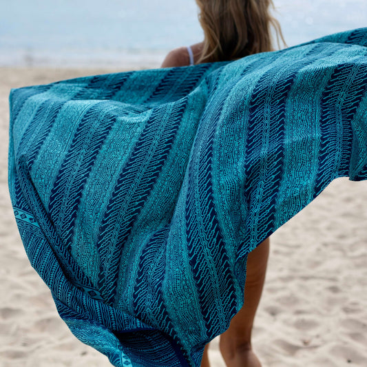Vivid luxe sarong worn as beach cover-up, flowing rayon fabric