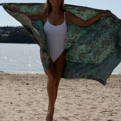 Close-up of green earth luxe sarong pattern, ideal for warm weather