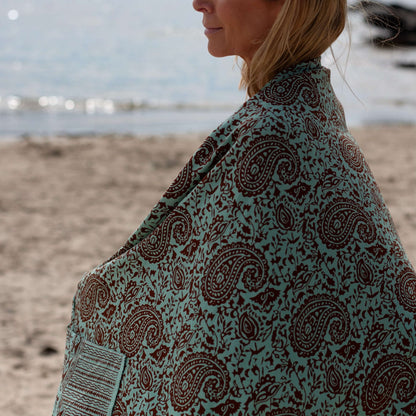 Close-up of green earth luxe sarong pattern, ideal for warm weather