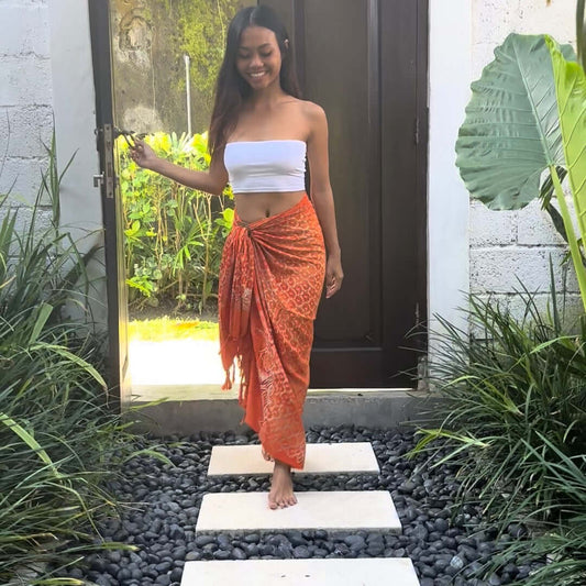 Vibrance Mandarin Beach Sarong walking through doorway