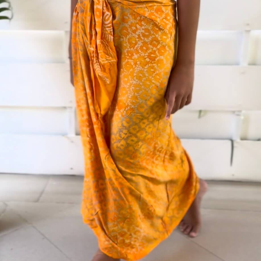 Vibrance Saffron Beach Sarong walking image