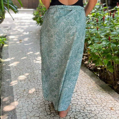 Adventurei luxe sarong styled on beach model wearing sarong hut design