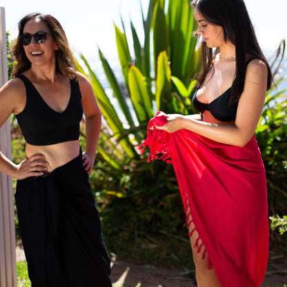 Bold red beach sarong sarong tied at hip, lightweight rayon by sarong hut