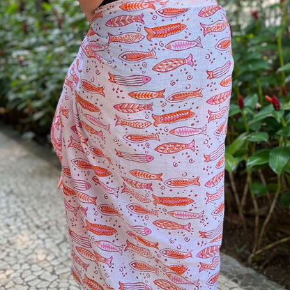 Cancun cotton sarong styled on beach model wearing sarong hut design