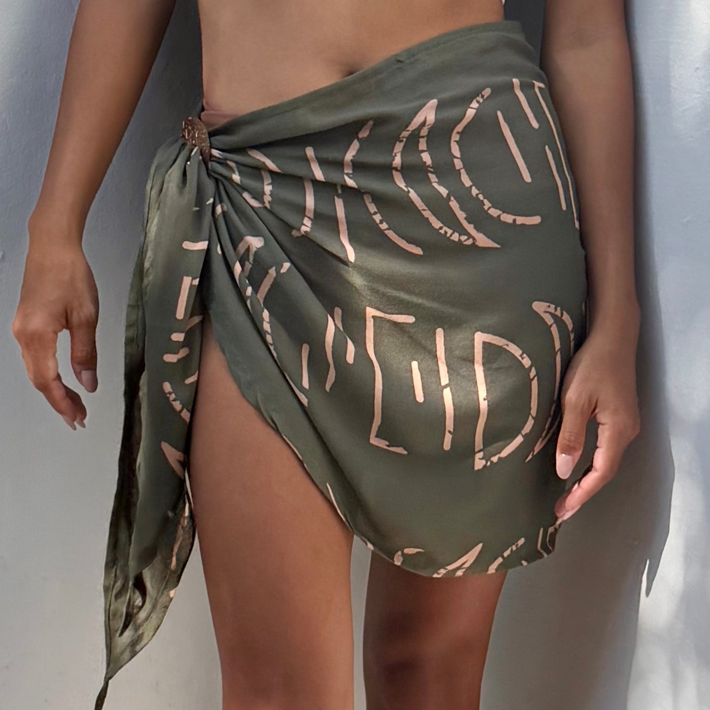 Close-up of mini sarong espresso olive pattern, ideal for warm weather
