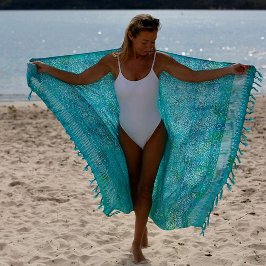 Free spirit aqua beach sarong beachwear look, photographed outdoors in natural light