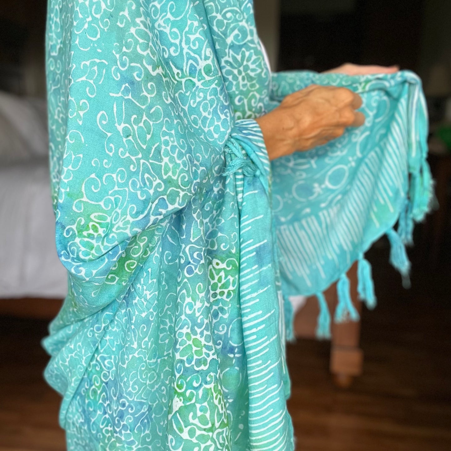 Free spirit aqua beach sarong beachwear look, photographed outdoors in natural light