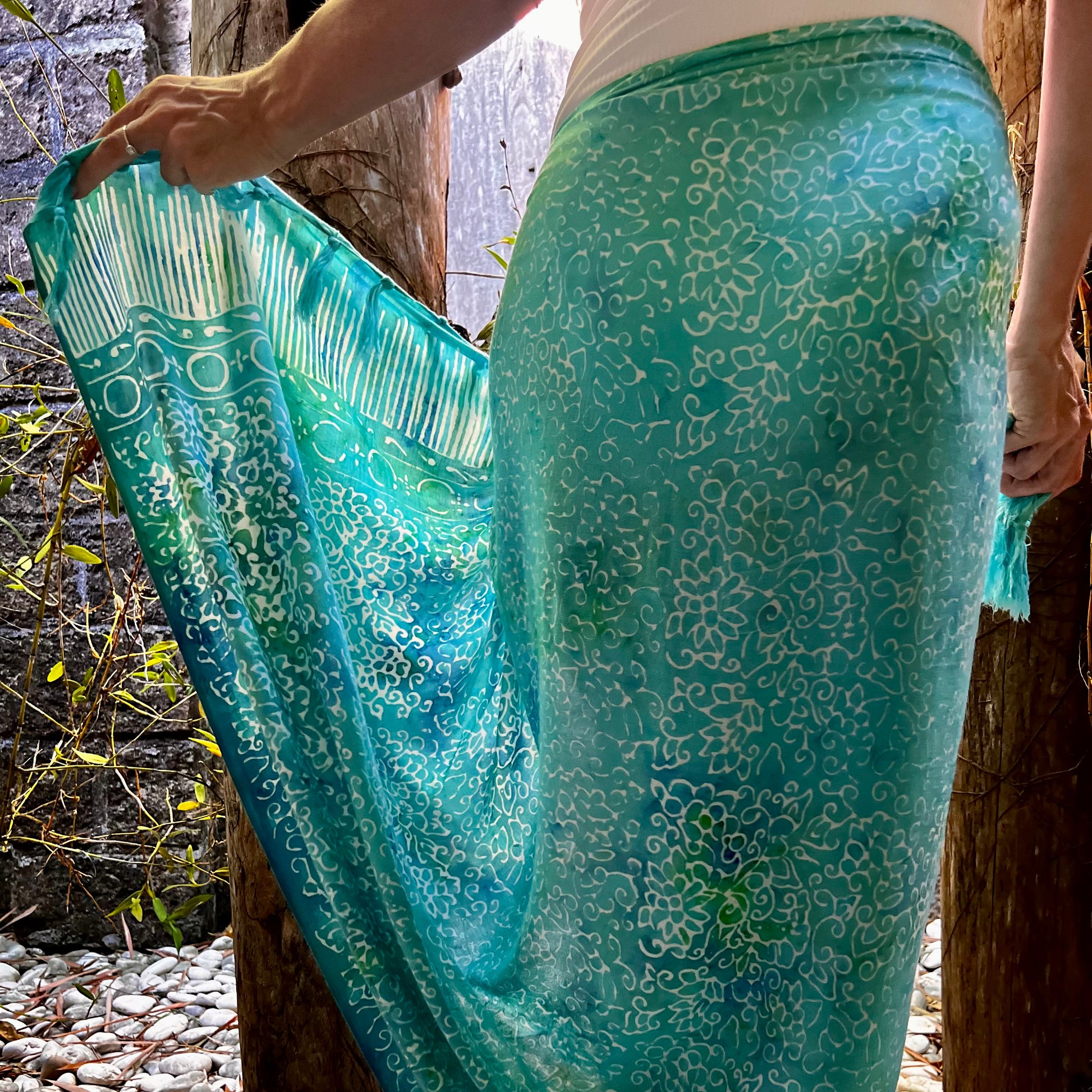 Free spirit aqua beach sarong beachwear look, photographed outdoors in natural light