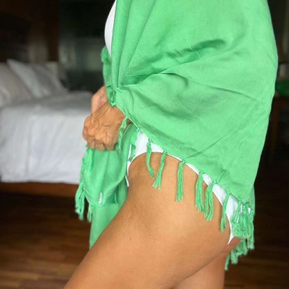 Green pop beach sarong worn as beach cover-up, flowing rayon fabric