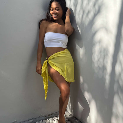 Mini sarong  lemon beachwear look, photographed outdoors in natural light