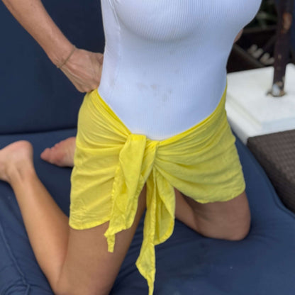 Mini sarong lemon worn as beach cover-up, flowing rayon fabric