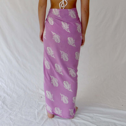 Lulu luxe beachwear look, photographed outdoors in natural light