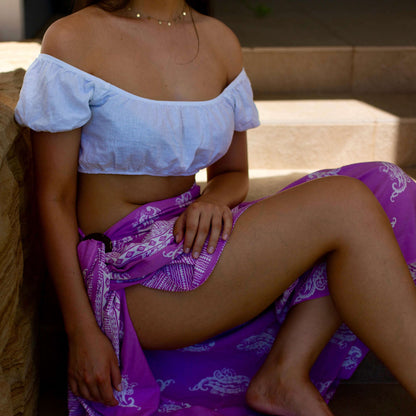 Lulu luxe beachwear look, photographed outdoors in natural light