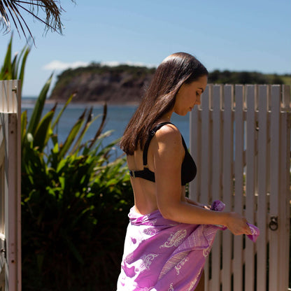 Lulu luxe beachwear look, photographed outdoors in natural light