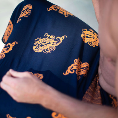 Manly luxe sarong worn as beach cover-up, flowing rayon fabric