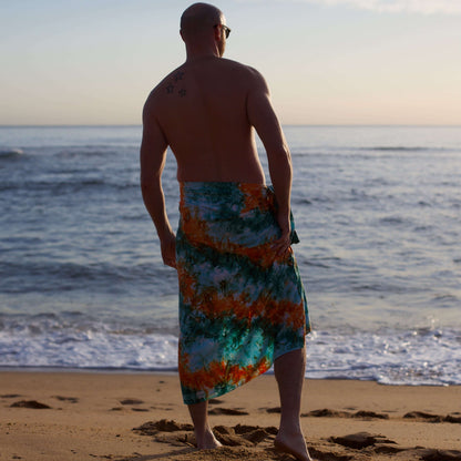 Oasis luxe mens sarong in orange and green rear view on beach