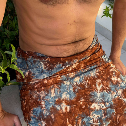 Opal mens luxe sarong worn as beach cover-up, flowing rayon fabric
