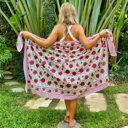Pomegranate cotton sarong beachwear look, photographed outdoors in natural light