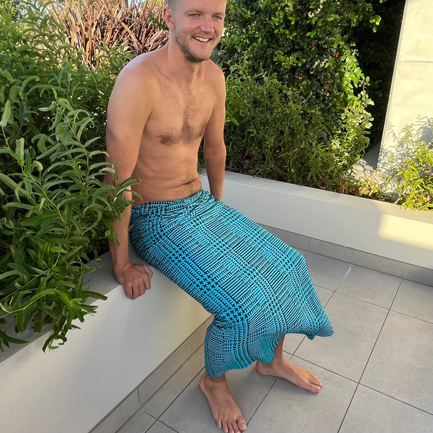 Ravage luxe sarong beachwear look, photographed outdoors in natural light