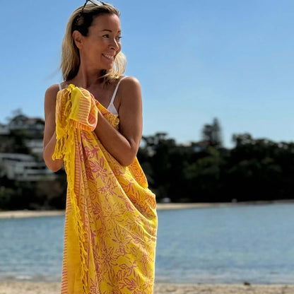 Relaxed beach sarong worn as beach cover-up, flowing rayon fabric