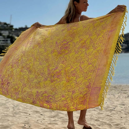 Relaxed beach sarong worn as beach cover-up, flowing rayon fabric