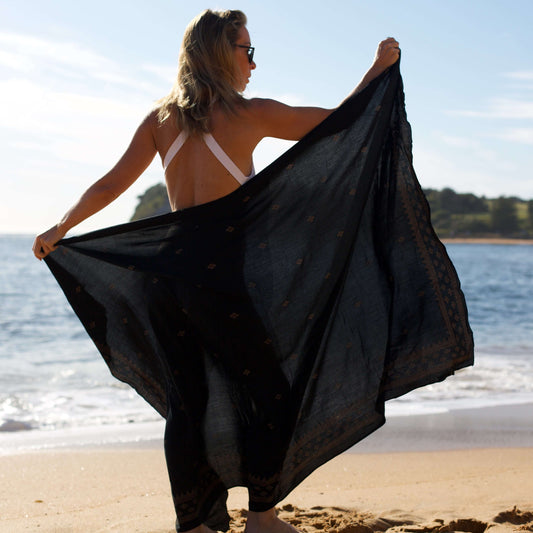 retreat womens black and gold sarong on the beach