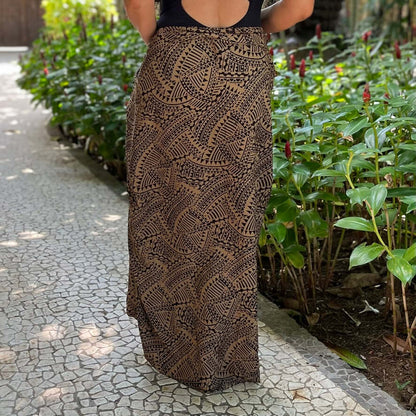 Spear fishing womens luxe sarong styled in garden rear shot