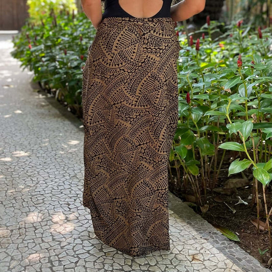 Spear fishing womens luxe sarong styled in garden rear shot