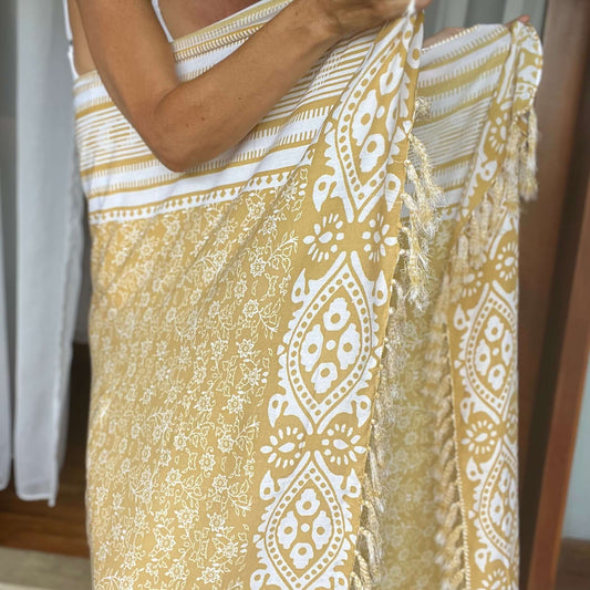 Summer bone beach sarong beachwear look, photographed outdoors in natural light