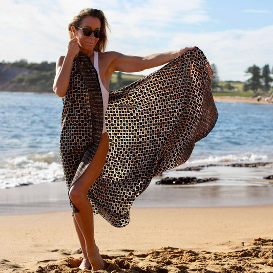 Tarzan luxe sarong beachwear look, photographed outdoors in natural light